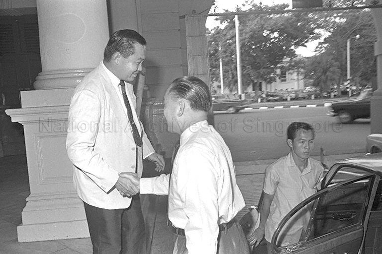 President of Singapore Art Society Ho Kok Hoe (left) greeting Minister of State for Culture Lee Khoon Choy (centre) on his arrival for opening of Lee Man Fong's art exhibition at Victoria Memorial Hall