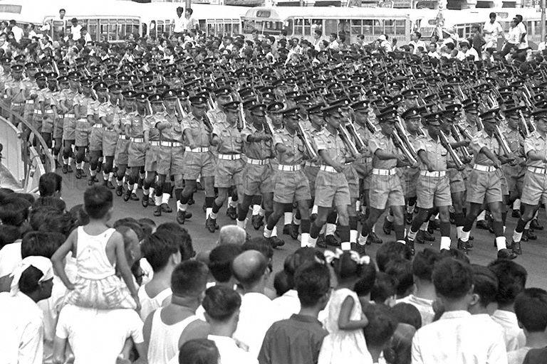 National Day Parade 1967 at the Padang - Police Force contingent marching through the streets