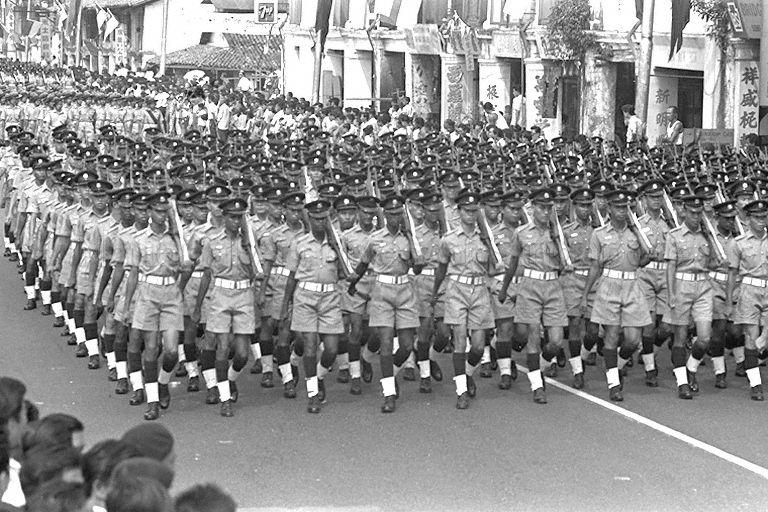 National Day Parade 1967 - The Singapore Police Force contingent marching through the streets