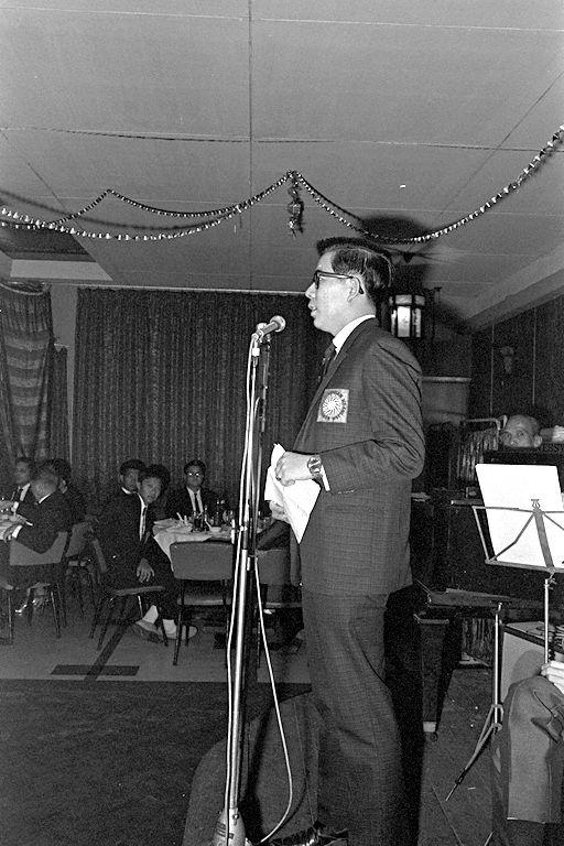 An emcee speaking on stage during Singapore Polytechnic Students' Union Graduation Dinner located at the Celestial Room, Amber Mansion. The event is also attended by Minister of State for Education Rahim Ishak's (not pictured)