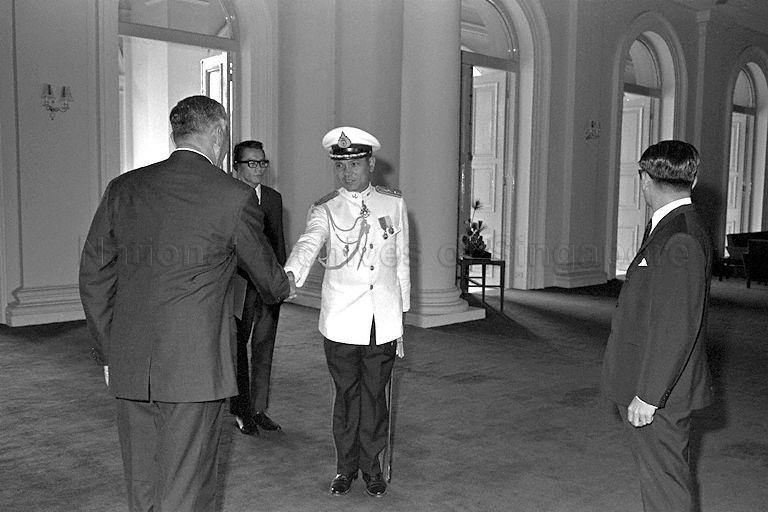 President Yusof Ishak shaking hands with a military officer at Istana.