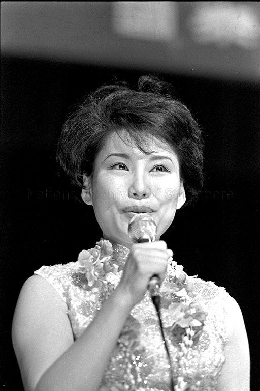 Hong Kong recording artist Mona Fong performing at "all-stars" variety show in aid of children charities. This show is organized by Radio and Television Singapura at the National Theatre.