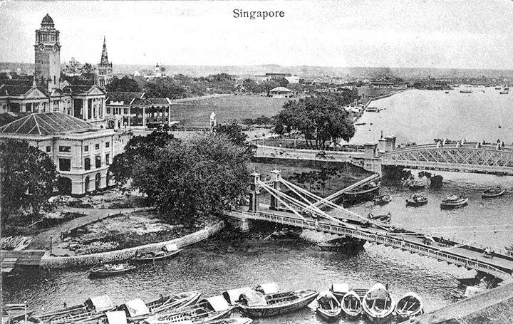 View of Empress Place, with clock tower of Victoria Memorial Hall and spire of St Andrew's Cathedral visible. Over the Singapore River are Cavenagh Bridge (foreground) and Anderson Bridge.