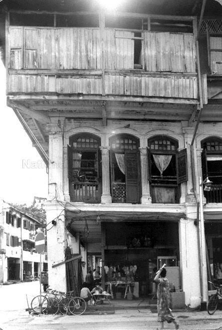Corner of Temple Street, at junction with Trengganu Street. The three-storey building featured is the former Lai Chun Yuan opera theatre, believed to have been built in 1887, offering Cantonese opera performed by local, China and Hong Kong troupes.