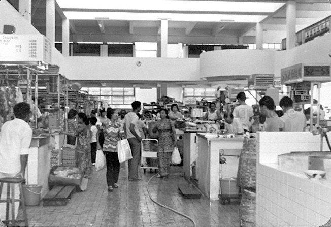 The newly-opened Zhujiao Centre or Tekka Centre (as it was renamed in 2000). The market was originally located between Hastings Road and Sungei Road, and first known as Kandang Kerbau (or just KK), Malay for "buffalo pens", referring to the slaughterhouses operating in the area until the 1920s. It was also known as Tek Kia Kha, in Hokkien where it means "foot of the small bamboos", because bamboo plants once grew on the banks of the Rochor Canal. Its name was later adapted to Tekka Pasar, where pasar is Malay for "market".