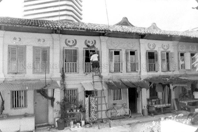 Dwelling houses facing the entrance of Masjid Abdul Gafoor within the mosque grounds at 41 Dunlop Street with Sim Lim Tower in the background. After the completion of renovation and restoration works to the mosque in 2003, they now house the Madrasah (Islamic Religious School).