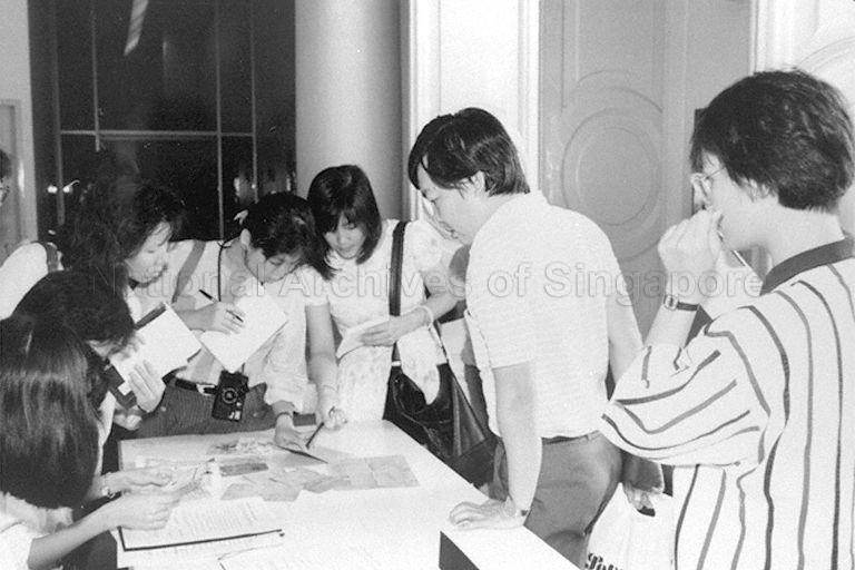 Members of the public donating old documents at the National Museum during Walk-in-Donation of Singapore Heritage Week 1987