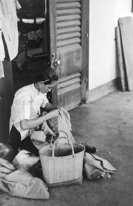 "Sew Sew" Chinese woman who comes round at Royal Air Force Tengah to provide sewing and mending services for residents