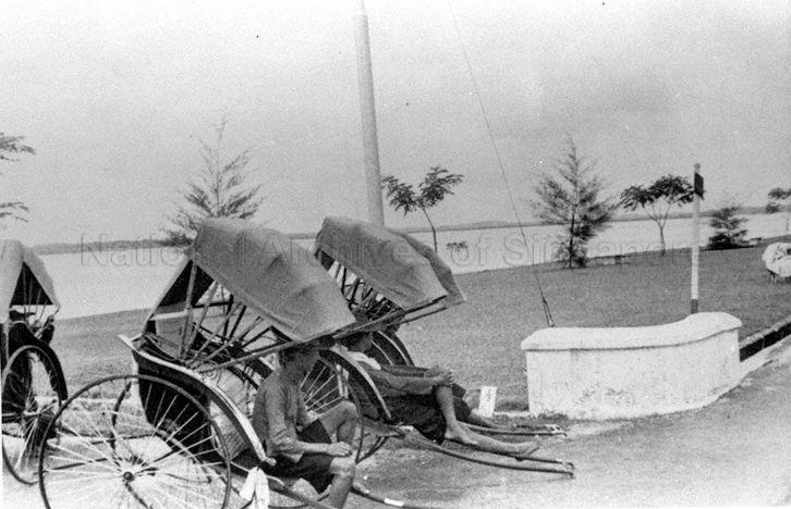 Photograph of rickshaw pullers resting by the water front, taken by Gavin G Wallace