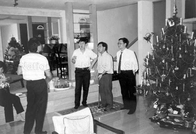 From right, Treasurer of Designers Association Singapore (DAS) Johnny Lewis, President of DAS Michael Gan, Tan Khee Soon and Mrs Cindy Hales (seated) attending DAS Executive Committee's Christmas dinner at residence of Ronnie Tan (back to camera).