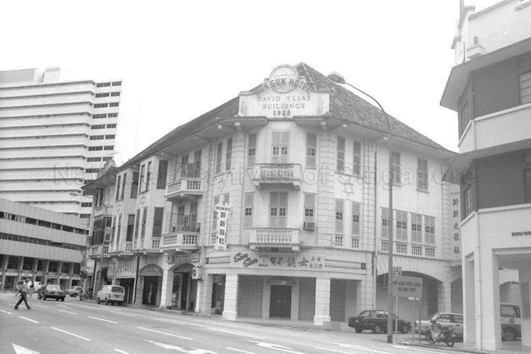 View of Sun Sun Hotel located within David Elias Building in Middle Road near the junction with Selegie Road. The building on the right is the National Skin Centre which was occupied by the Middle Road Hospital until 1988.