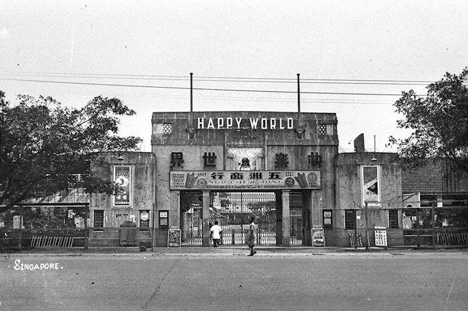 View of Happy World amusement park located between Geylang Road and Mountbatten Road. On the right is the ticketing booth for Victory Theatre while on the left is the ticketing booth for boxing matches. It was set up in 1936, renamed Gay World in 1966 and closed down in 2000.