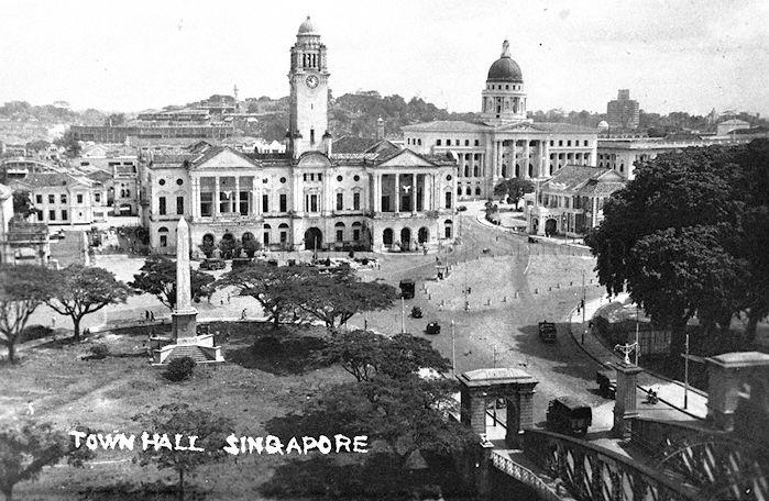View of Dalhousie Obelisk (foreground left), Victoria Theatre and Memorial Hall (with clock tower, was former Town Hall), Supreme Court (with dome), Singapore Cricket Club (centre, right) and the Cathay Building (background right)