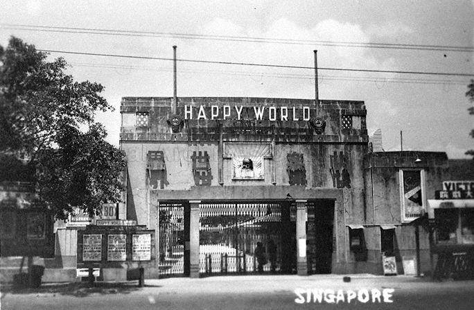 View of Happy World amusement park located between Geylang Road and Mountbatten Road. On the right is the ticketing booth for Victory Theatre while on the left is the ticketing booth for boxing matches. It was set up in 1936, renamed Gay World in 1966 and closed down in 2000.