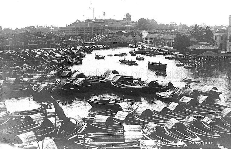 View of Boat Quay with arches of the second Elgin Bridge across the Singapore River in the background