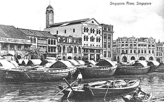 View of Singapore River and South Boat Quay showing godowns. In the centre is Guthrie and Company's head office building with its tower.