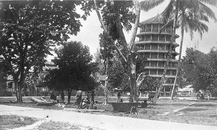 Water tower in Teluk Anson (now Teluk Intan), Perak, Federated Malay States. The pagoda-styled water tower was built by Chinese contractor Leong Choon Cheong in 1885 but started to lean after construction. It is now a tourist attraction and known as the "Leaning Tower of Teluk Intan".
