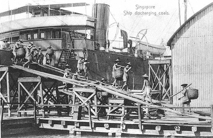 Dockworkers, mainly Chinese coolies (or labourers), unloading coal from a ship at wharves of the Tanjong Pagar Dock Company