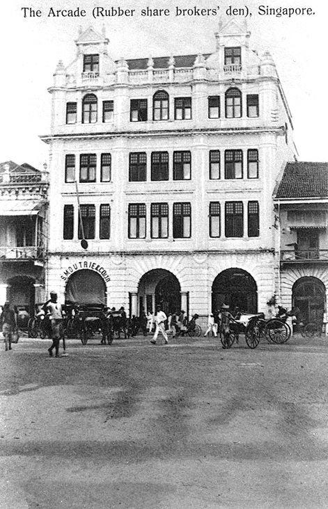The Arcade at southeast end of Raffles Place, Singapore. The building was a "den" for rubber share brokers.