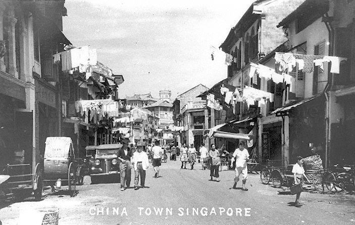 Street scene and shophouses along China Street, looking towards Club Street and buildings on Ann Siang Hill (background). The first fully in view shophouse unit (from right) is 48 China Street, which is part of a two-storey unit with a mezzanine half floor. 48 China Street was the first (in 1918) and in the 1930s to be the â€˜headquartersâ€™ of a seafood (mainly crabs) distribution business. The stack of cane baskets in front of the shop was used to contain live crabs, while the trishaw nearby transported the baskets of live crabs to various wet markets. The shophouses on right are now part of China Square Central.