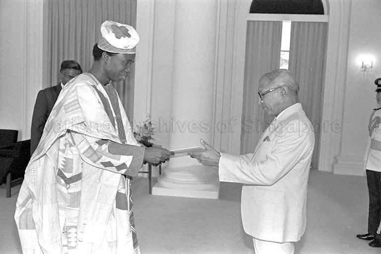 Nigerian ambassador-designate Gabriel Akinola Falase handing over the Letter of his Credence to President Devan Nair during the presentation of credentials ceremony at the Istana