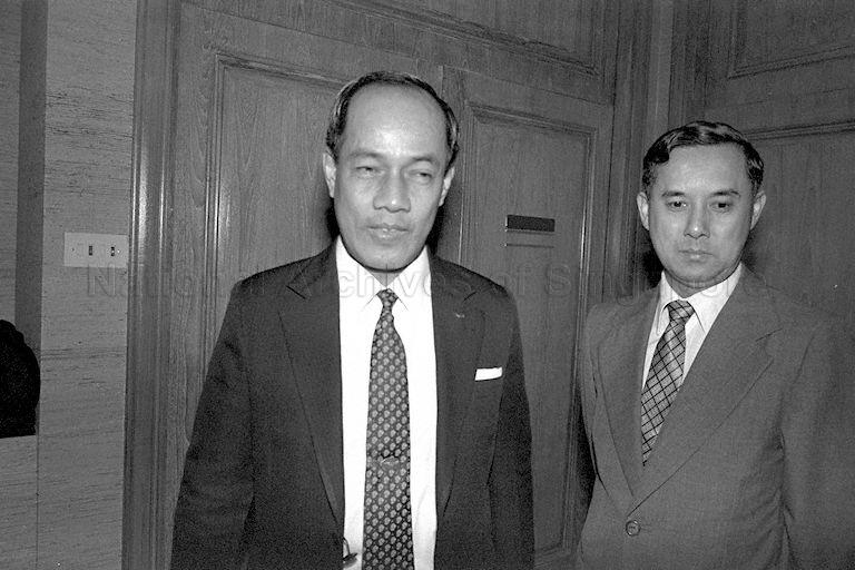 Burmese Trade Minister U Khin Maung Gyi (left) and Burmese Charge d' Affaires in Singapore U Khin Muang Soe (right) are at the Monetary Authority of Singapore Building.