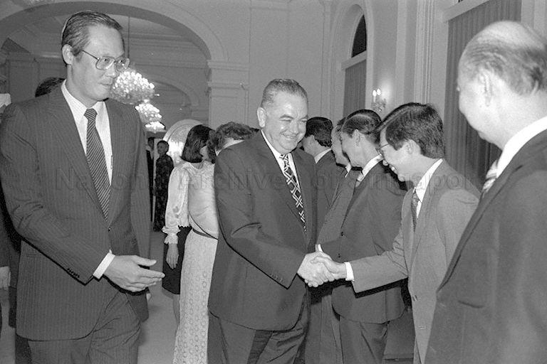 Romanian Prime Minister Constantin Dascalescu (centre) shaking hands with an official during a dinner hosted by first Deputy Prime Minister Goh Chok Tong (left) at the Istana.