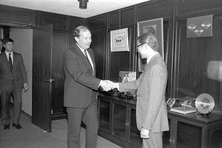 Western Australian Premier Brian Burke (second from right) shaking hands with Finance Minister Dr Tony Tan Keng Yam (far right) at the Central Provident Fund Building