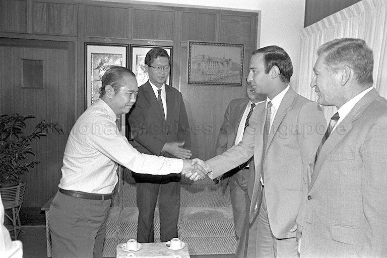 Bulgarian Deputy Minister of Culture Vladimir Zhivkov (second from right) shaking hands with a Singapore official at the Ministry of Education building at Kay Siang Road. Also present is Minister of State for Communications and Information and Education Dr Tay Eng Soon (centre).