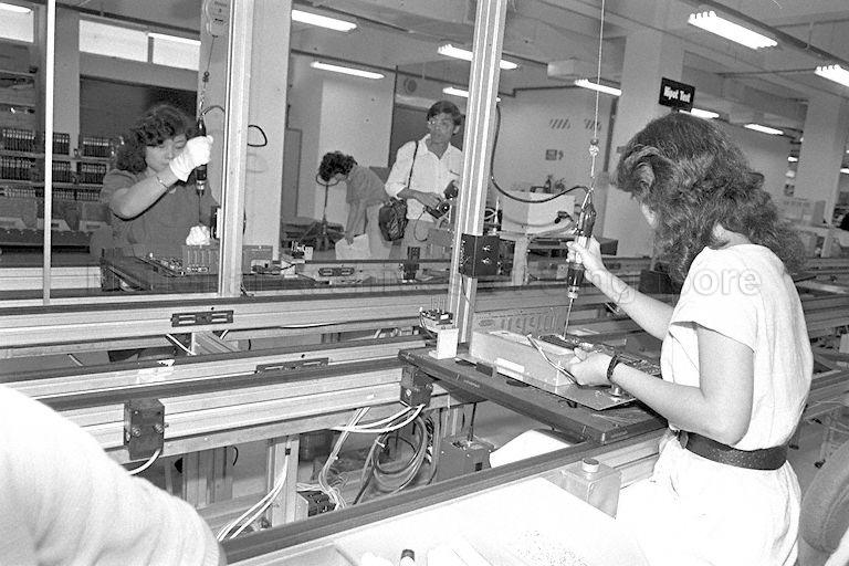 Staff of Apple Computer International Ltd at Block 5002, Ang Mo Kio Avenue 5 at Ang Mo Kio Industrial Park 2. This is a picture taken during the visit of Minister of State for Defence and Trade and Industry Brigadier-General (Reservist) Lee Hsien Loong to the Apple Computer International Ltd Open House.