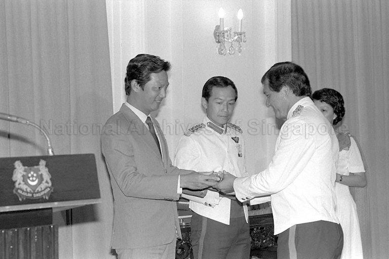 Minister for Communications and Information and Second Minister for Defence Dr Yeo Ning Hong (left) presenting award during the Third Reservist Officers' Staff Course graduation ceremony at Istana