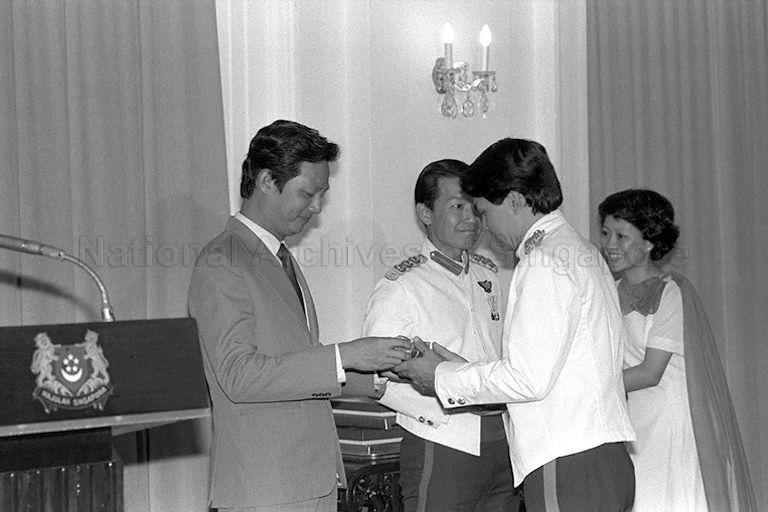 Minister for Communications and Information and Second Minister for Defence Dr Yeo Ning Hong (left) presenting award during the Third Reservist Officers' Staff Course graduation ceremony at Istana