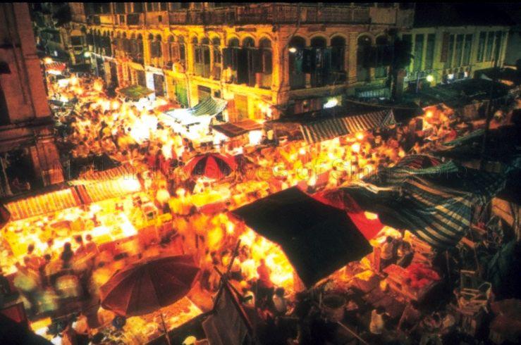The building in the centre was the famous "Lai Chun Yuen" 834-seater theatre built in 1887 which staged Cantonese operas. Located at the corner of Smith Street and Trengganu Street, it was badly damaged during World War II. After post-war renovations, the building was used as a merchandise shop and later a warehouse for street hawkers.