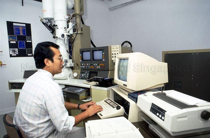 STAFF AT COMPUTER AT OFFICIAL OPENING OF SINGAPORE INSTITUTE