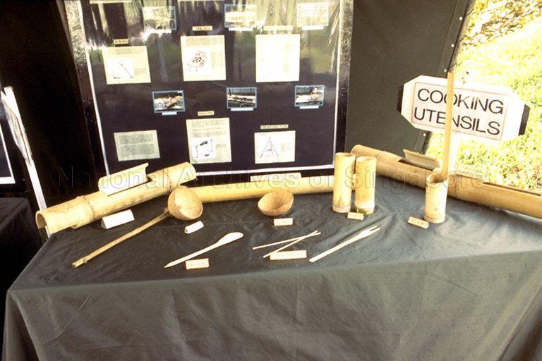 Display of cooking utensils used in the field at Singapore Armed Forces (SAF) exhibition "SAF at 25" at Paya Lebar Airport. The exhibition is organised by the SAF Combat Engineers as part of the SAF's silver jubilee celebrations, and gives an insight into the history of the SAF and how it might evolve in the future.