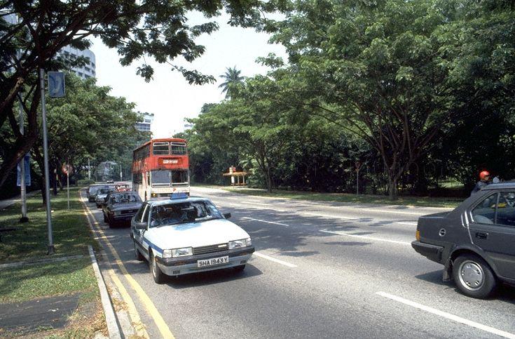 View of traffic along Orchard Boulevard, Singapore. Boulevard Hotel, located between Orchard Boulevard and Cuscaden Road, is partly visible in the background on left.