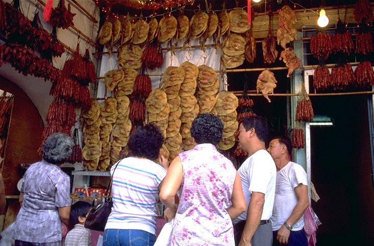 Waxed duck and waxed sausage being sold at "five-foot-way" stall in Chinatown