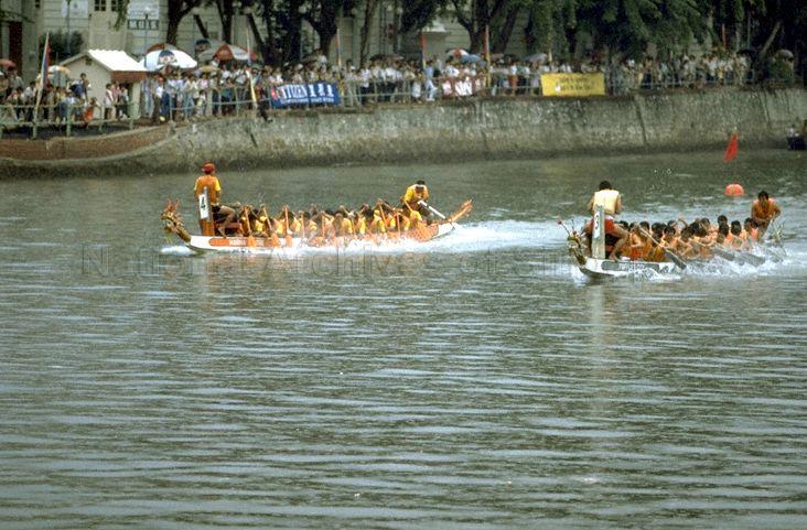 Raffles City and Marina Centre teams in dragon boat race during third River Regatta at Singapore River
