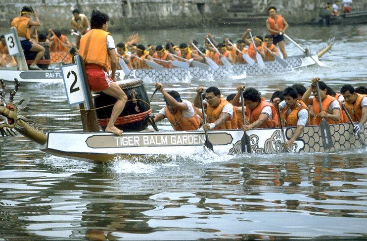 Tiger Balm Gardens and Raffles City teams in dragon boat race during third River Regatta at Singapore River