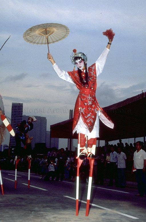Stilt walkers performing at the Padang during Opening of a
