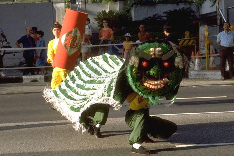 Green lion dance performance during full dress rehearsal of Chingay parade, which showcases local and foreign cultural performing groups, along Orchard Road. The annual street parade jointly organised by People's Association (PA), Singapore Tourist Promotion Board (STPB), Singapore Hotel Association and Singapore National Pugilistic Federation is the highlight of Singapore's Lunar New Year festivities.