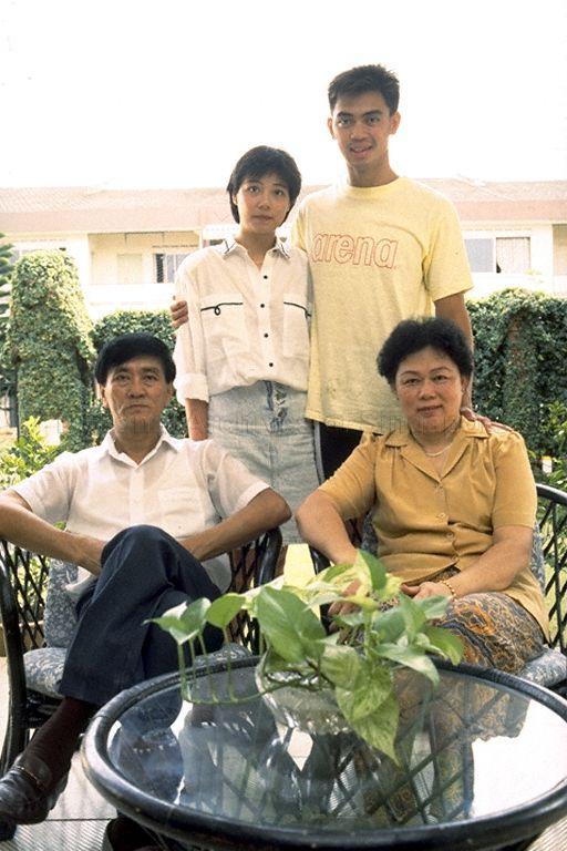 Photo taken during interview with swimmer and Southeast Asian Games 1989 medallist David Lim (standing right) at his home at Mei Hwan Drive; David's parents Anthony Lim and Goh Fong Eng are seated
