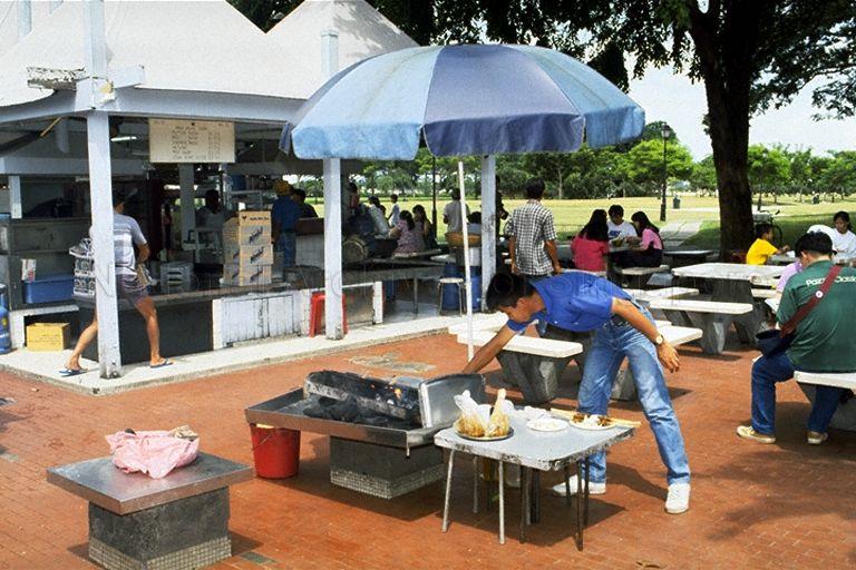 Stallholder at the open-air food centre Satay Club, Queen Elizabeth Walk