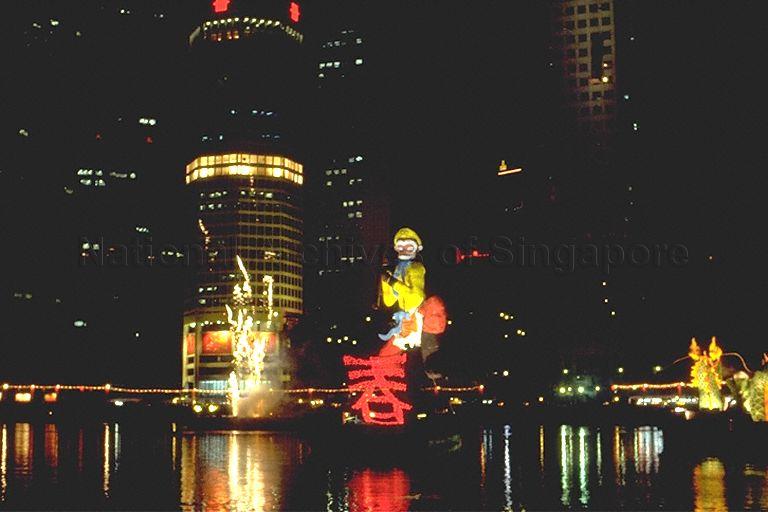 Fireworks and five-story Monkey God float at Singapore River Hongbao 1992 gala show. 1992 was the Year of the Monkey, according to the Chinese zodiac calendar.