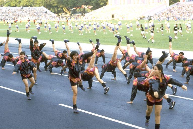 National Day Parade 1993 Preview at the Padang -- Participants from People's Association performing aerobics in mass display item Vitality in Motion, depicting the theme "Good Health" with different kinds of sports