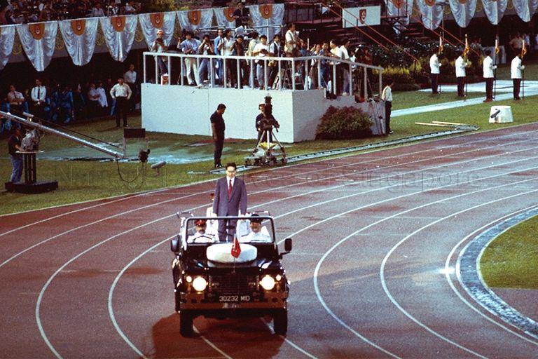 National Day Parade 1994 at National Stadium -- President Ong Teng Cheong riding around stadium in ceremonial Land Rover
