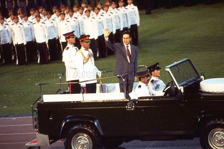National Day Parade 1994 at National Stadium -- President Ong Teng Cheong waving to spectators while riding around stadium in ceremonial land rover