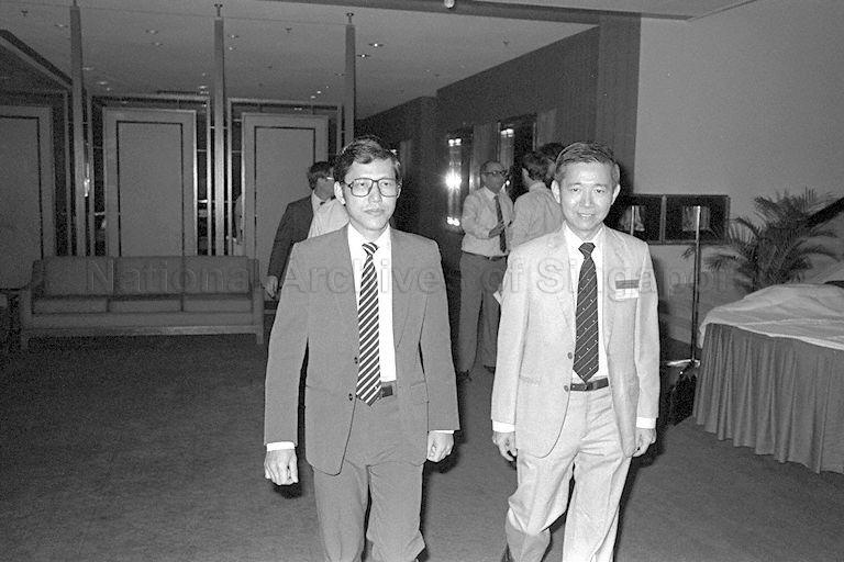 Minister of State for Finance Lee Yock Suan (left) arriving at Dynasty Hotel to attend opening of 14th Pacific Trade and Development Conference. With him is Member of Parliament for Whampoa Dr Augustine Tan Hui Heng.