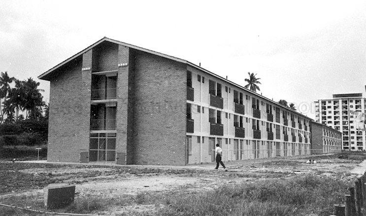 Rear view of a block of three-storey Housing and Development Board (HDB) flats, probably at Duchess Estate in Queenstown (Singapore's first satellite town), which was known for its several blocks of two and three-storey flats