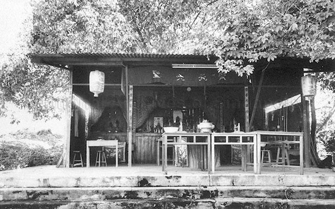 A Chinese temple dedicated to the Monkey God Sun Wukong, as evidenced by the Chinese words of "Qi Tian Da Sheng" on the banner above. This zinc roofed temple shed has the typical layout of Chinese temples with one main hall and two smaller halls on each side.